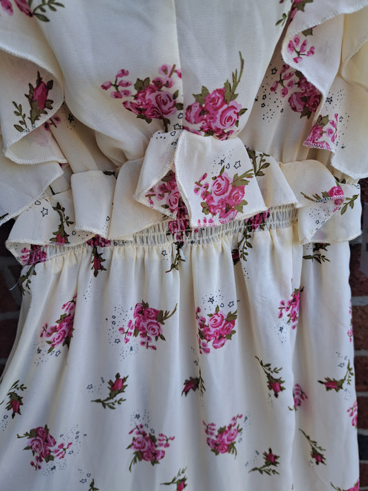 Robe beige fleurie décolletée sans manches avec étiquette