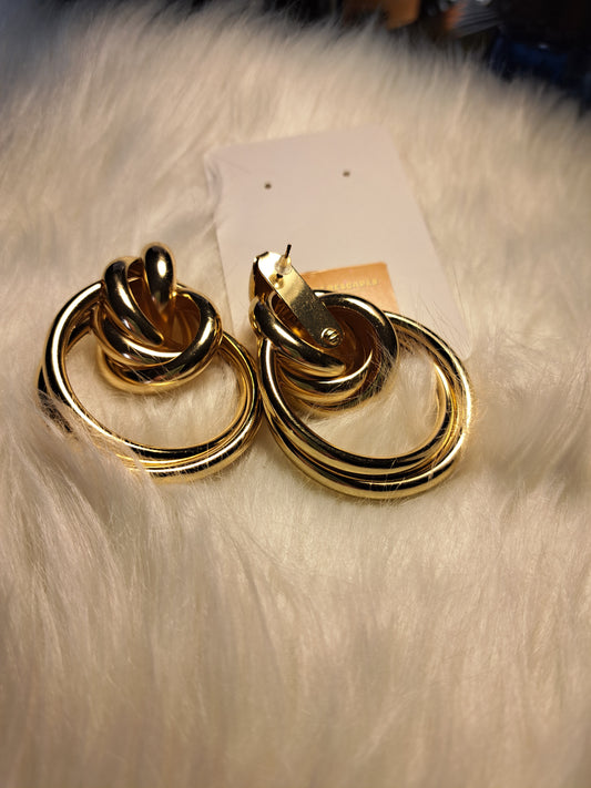 Grosses boucles d'oreilles dorés avec nœuds