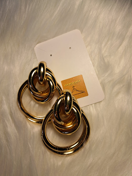 Grosses boucles d'oreilles dorés avec nœuds