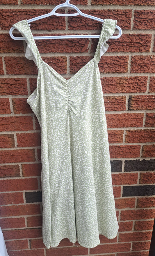 Robe verte pâle et blanche sans manches