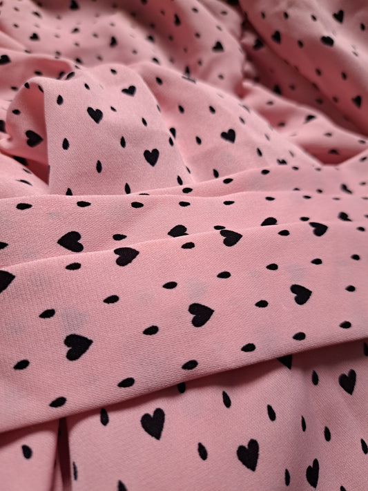 Robe à pois/coeurs rose et noire avec manches bouffantes