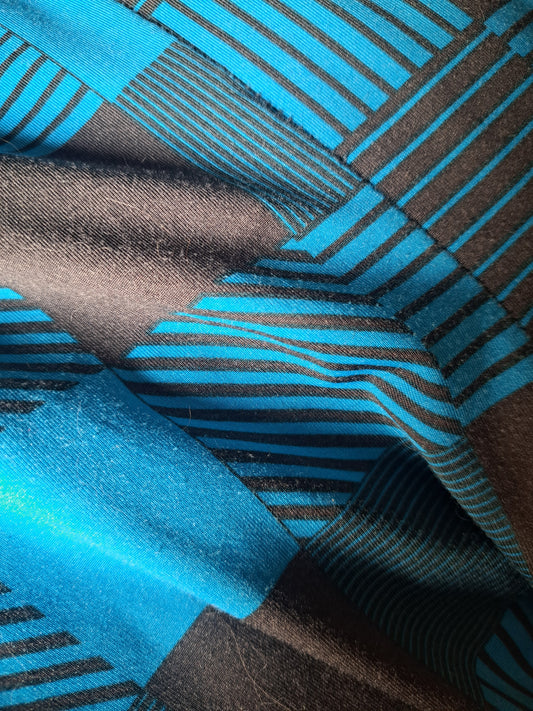 Pantalon style legging à carreaux bleu et noir