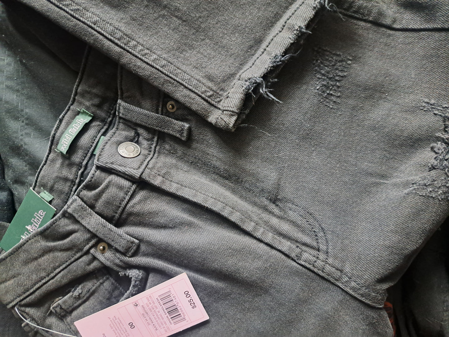 Jeans noir vintage troué avec étiquette