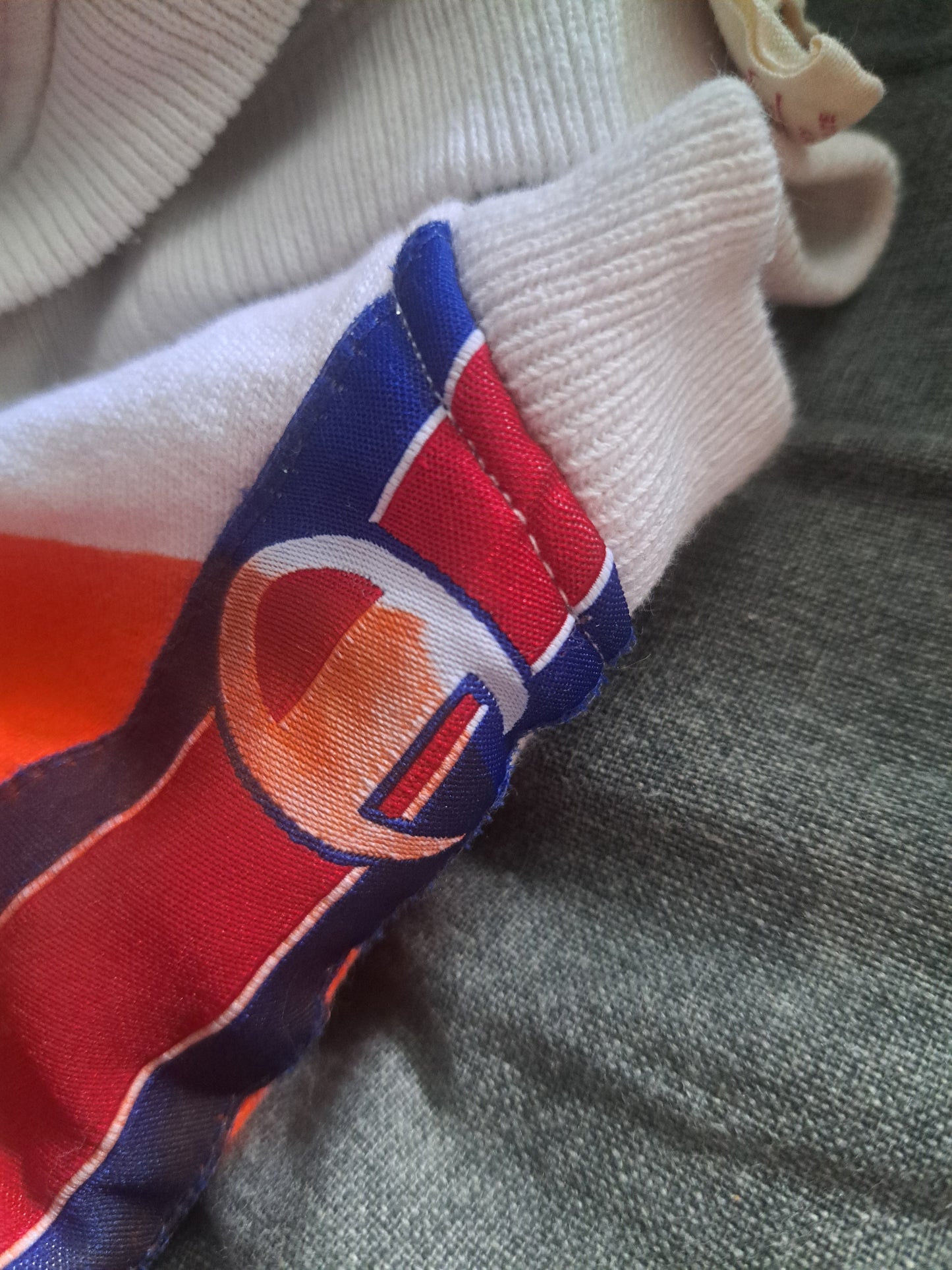 Chandail manches longues style hoodie Champion orange et bleu